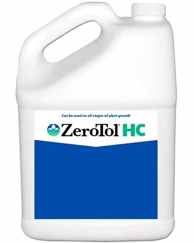 A close up vertical image of a plastic bottle of ZeroTol HC isolated on a white background.