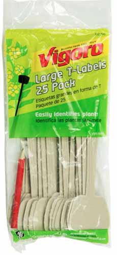 A close up vertical image of a package of Vigoro plant labels isolated on a white background.