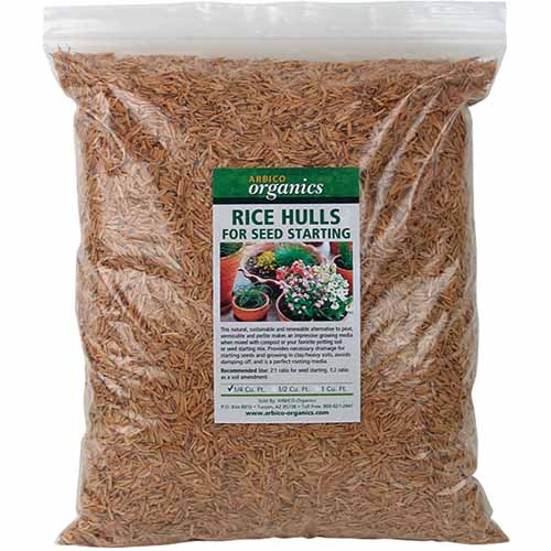 A close up square image of the packaging of a bag of rice hulls for seed starting isolated on a white background.