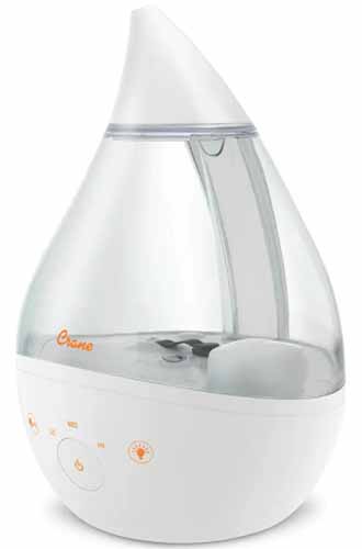 A close up square image of a small one-gallon humidifier isolated on a white background.