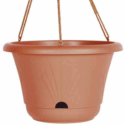 A close up square image of a self-watering plastic hanging basket isolated on a white background.