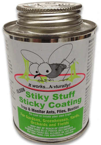 A close up of a bottle of Stiky Stuff Sticky Coating isolated on a white background.