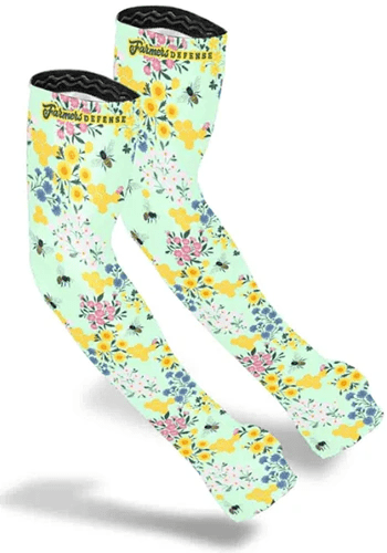 A close up of Farmers Defense Sleeves with a save the bees pattern isolated on a white background.