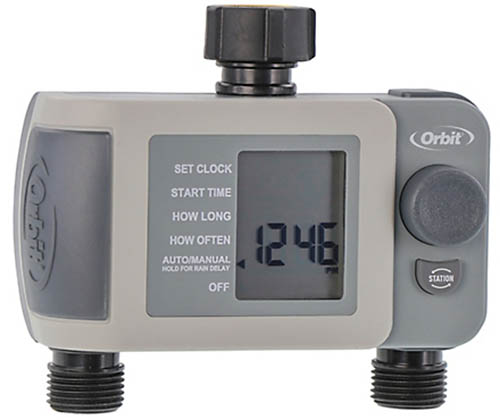 A close up of a watering timer isolated on a white background.