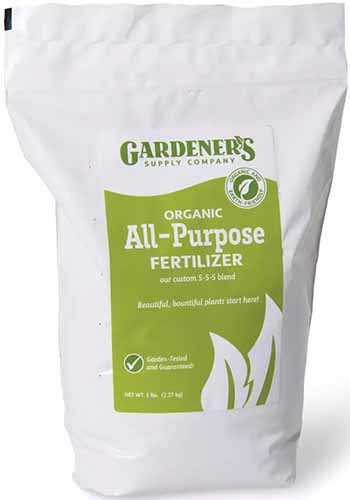 A close up of a bag of Gardener’s Supply Company Organic All Purpose Fertilizer isolated on a white background.