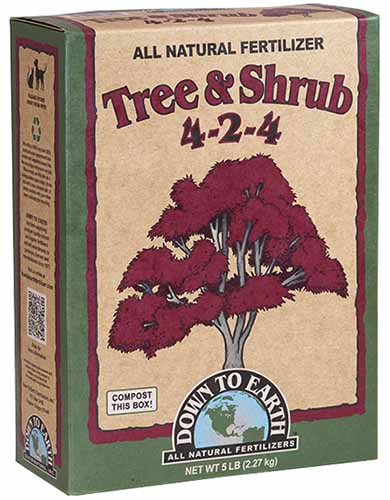A vertical product photo of a box of Down to Earth Tree &amp; Shrub 4-2-4 Fertilizer.
