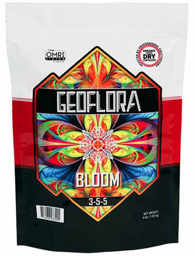 A close up of a bag of Geoflora Bloom fertilizer isolated on a white background.