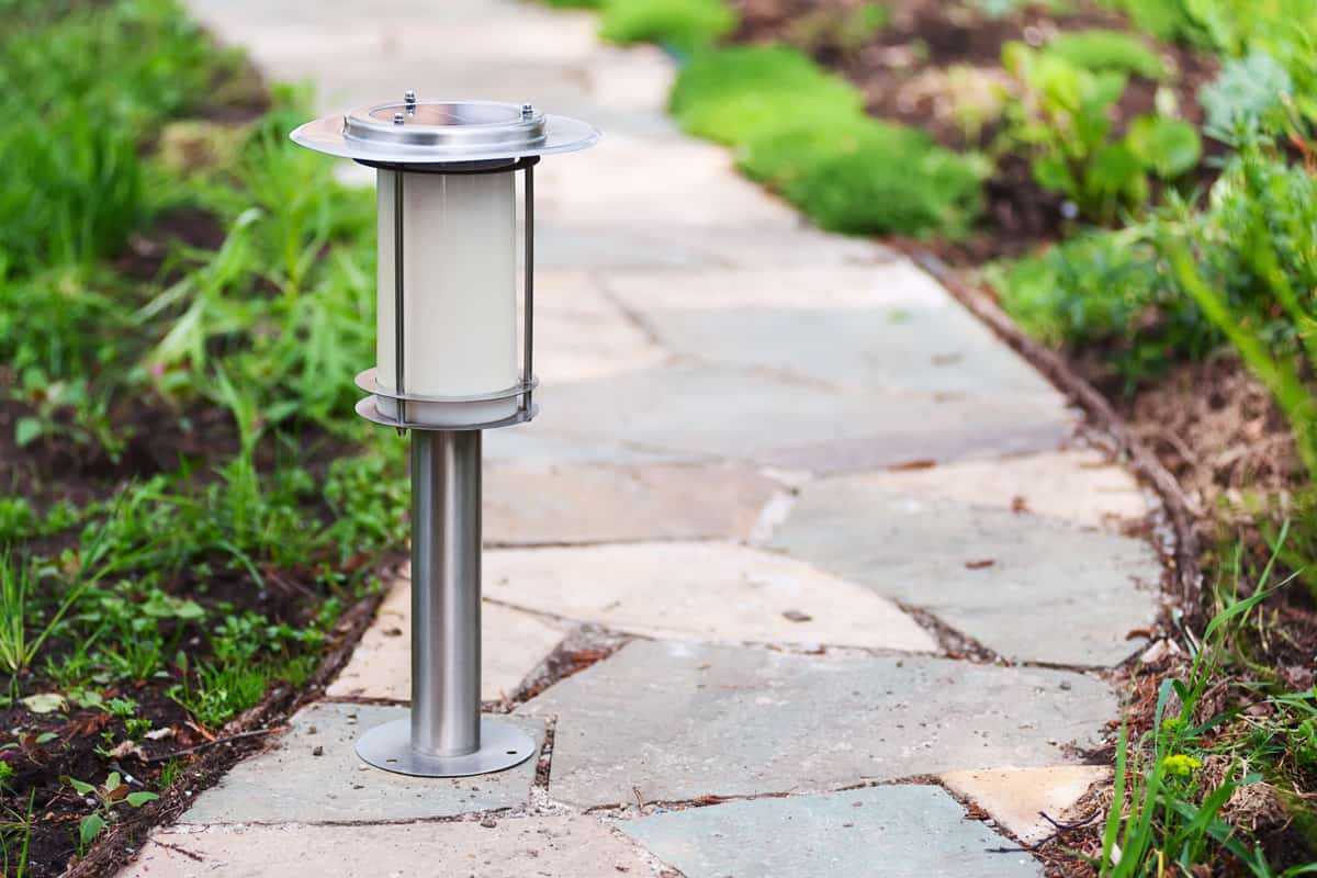 Solar-powered lamp on garden path.