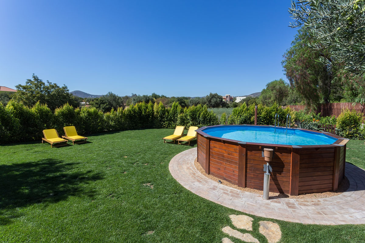 above ground pool sets on concrete wide yard on the garden