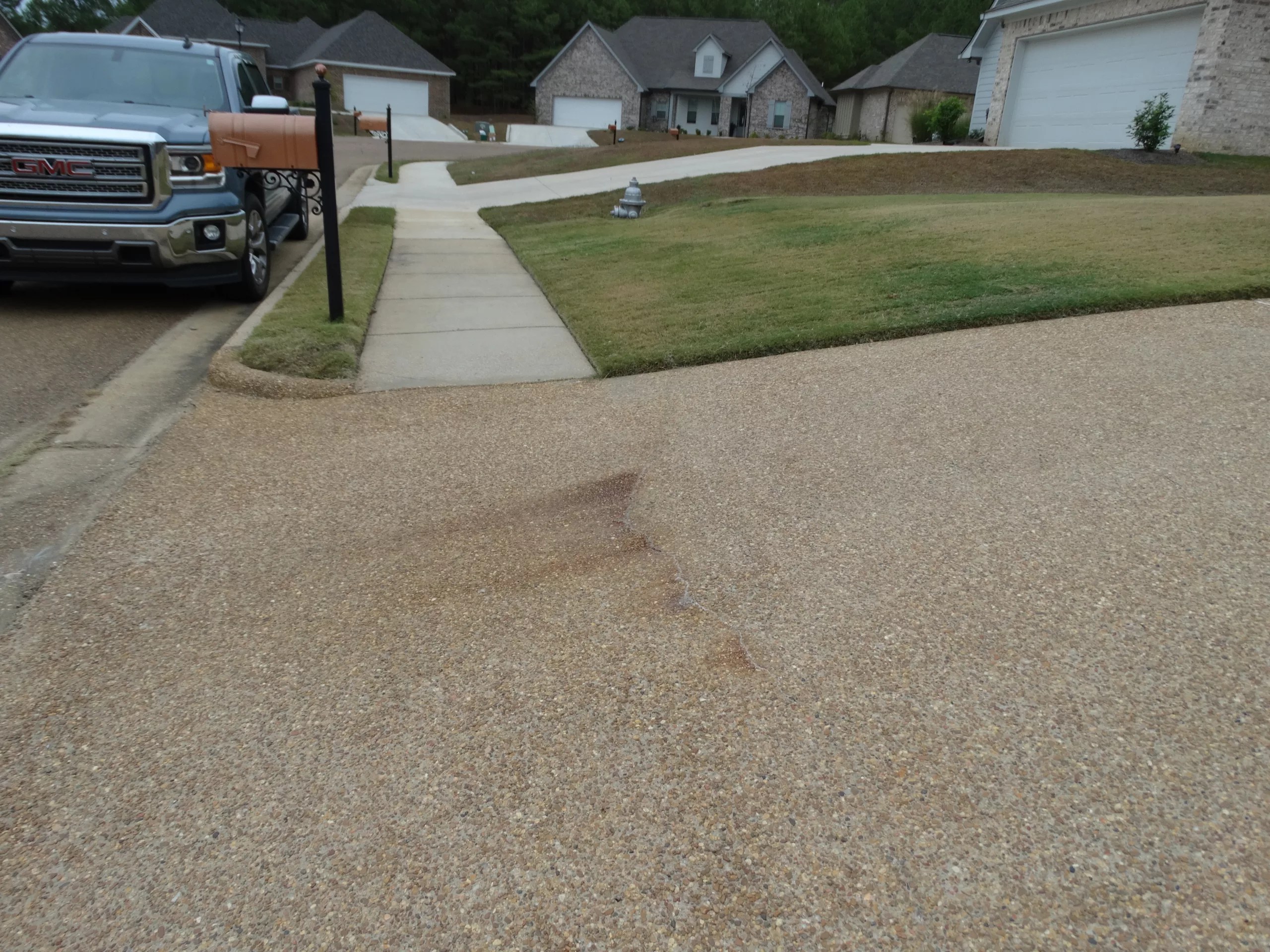 What is the Rust Colored Stain On My Driveway and Sidewalk?