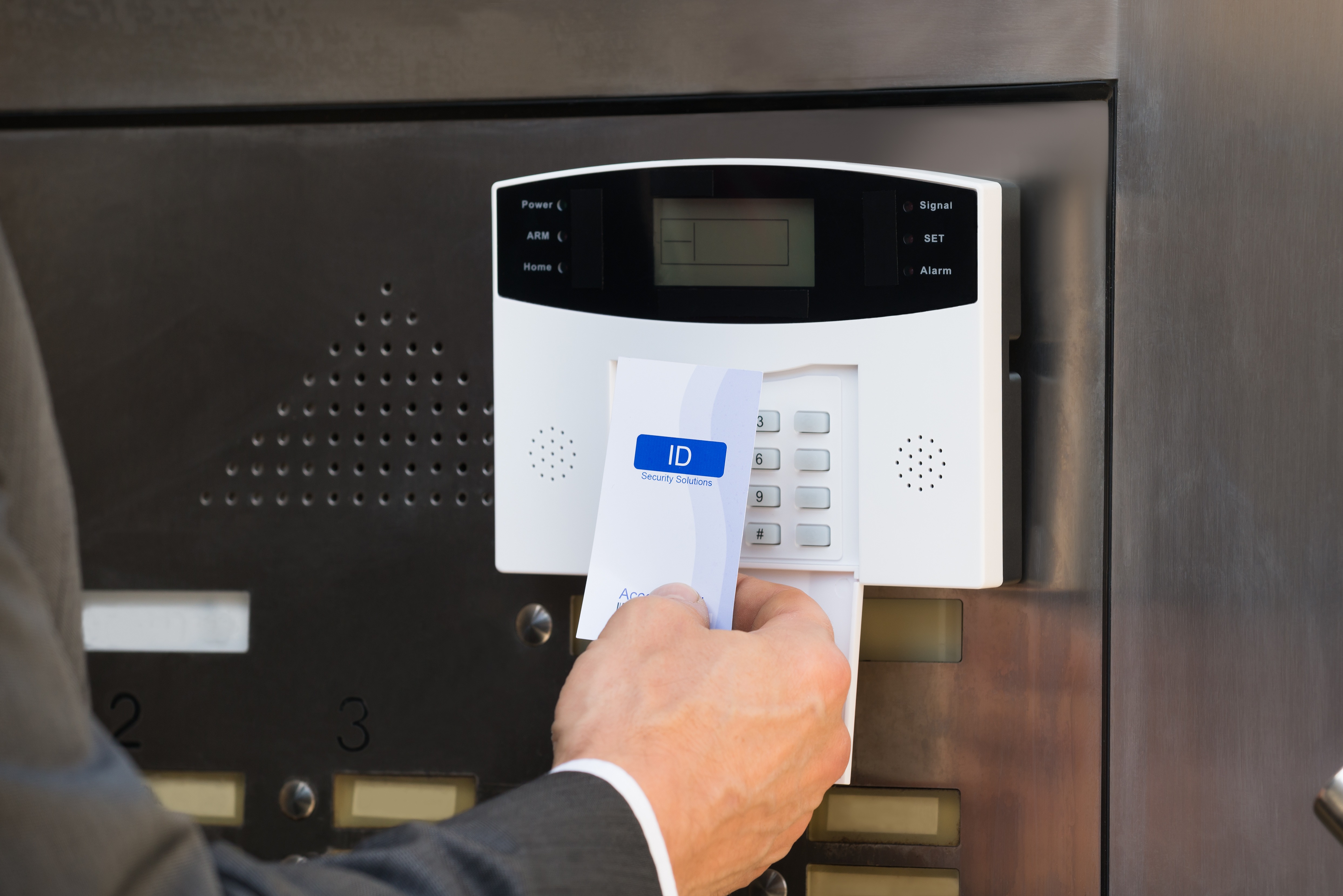 Closeup Of Businessperson Holding Keycard For Security System