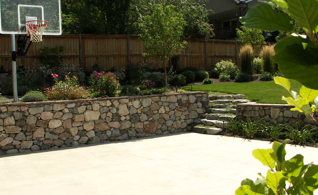 basketball court and stone wall G Brown Design