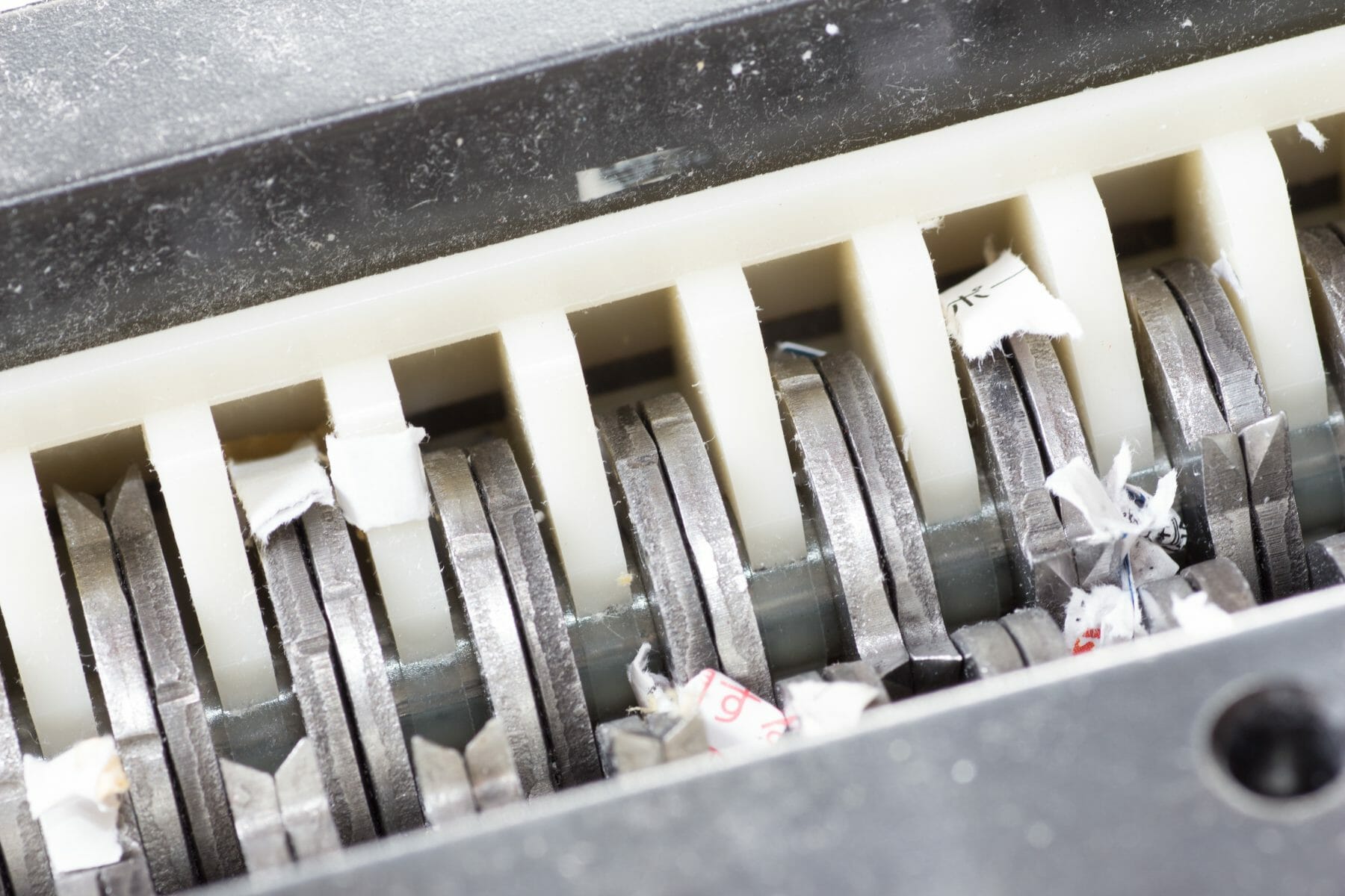 Jammed shredder scraps between paper shredder blades Global Document