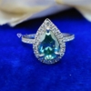 3.0 Ct (12x8 mm) Green Pear Cut Moissanite Engagement Halo Ring