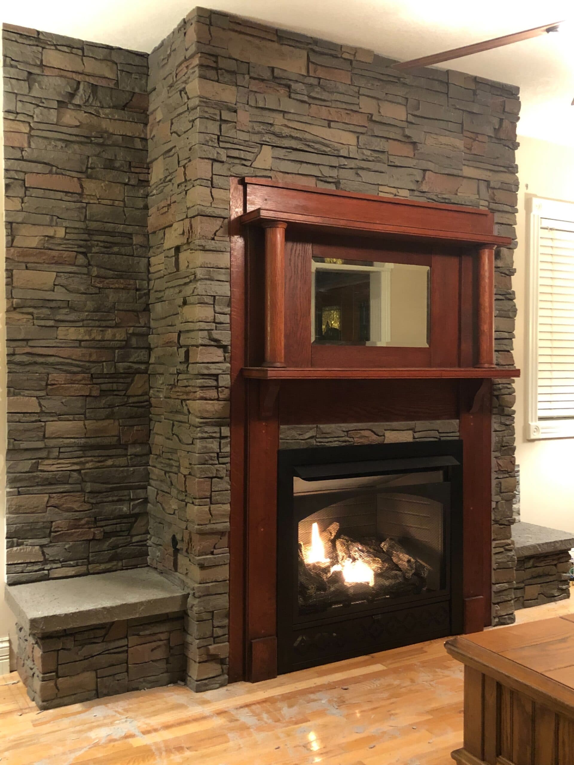 Faux Stone Fireplace with an Antique Mantel GenStone