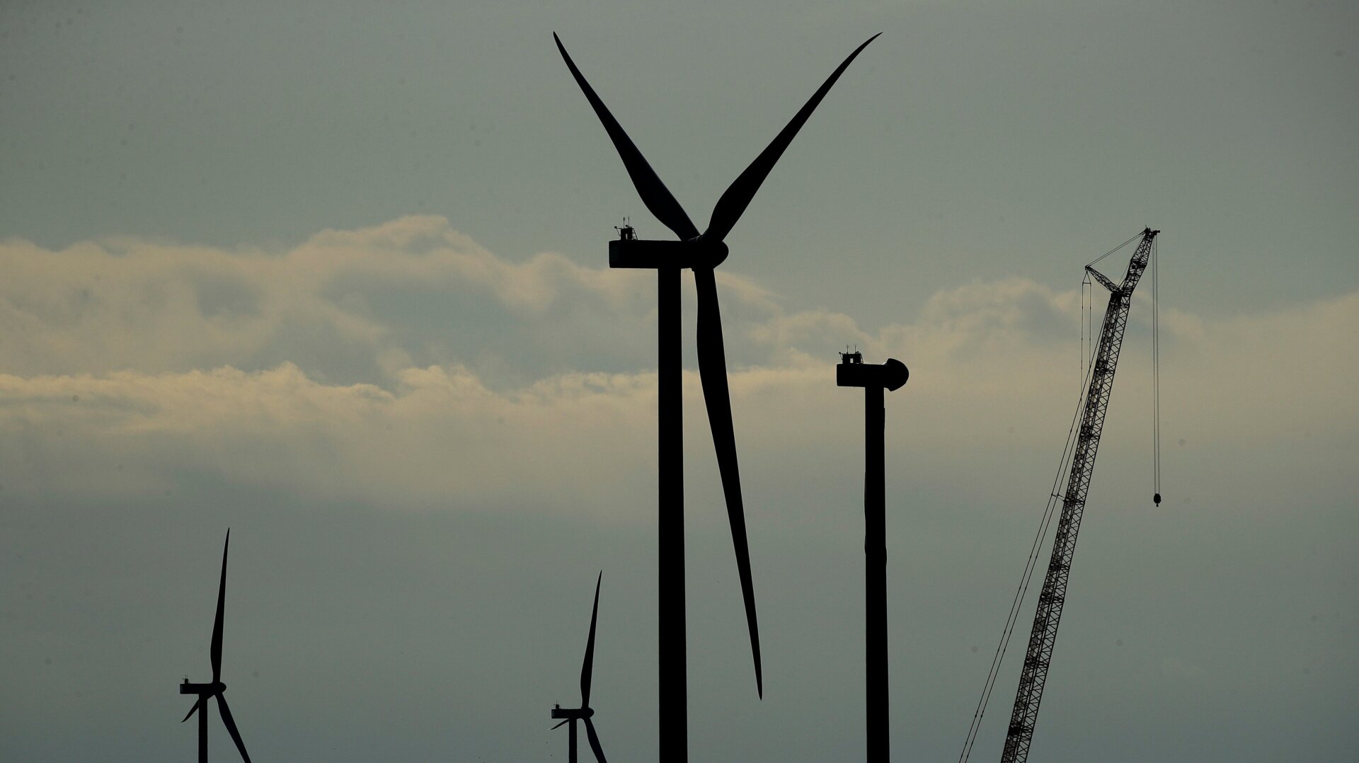 Wind turbines in various stages of completion.
