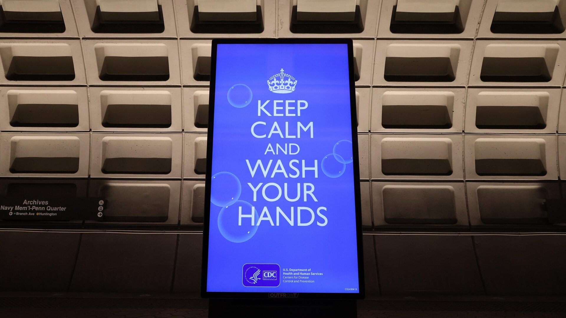 An electronic billboard flashes instructions on the train platform at the Archives station in Washington D.C. on March 25, 2020.
