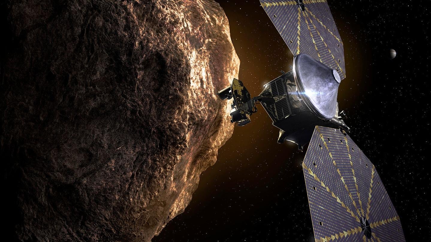 Artist’s depiction of Lucy zipping past a Trojan asteroid.