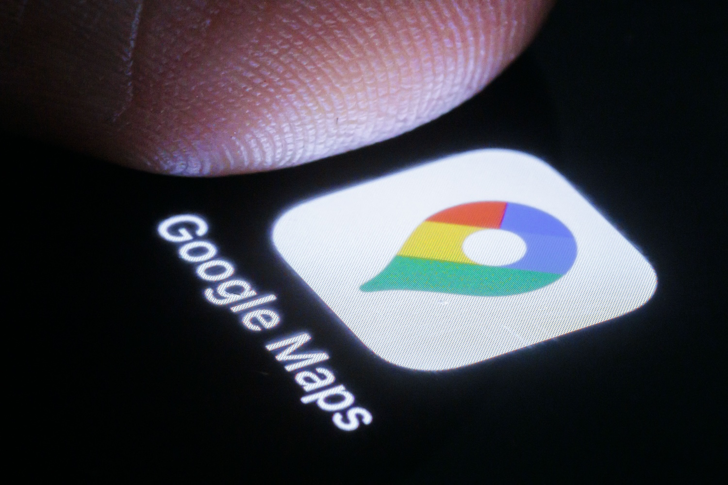 In this photo illustration the google maps app can be seen on a smartphone next to a finger on March 27, 2024 in Berlin, Germany.