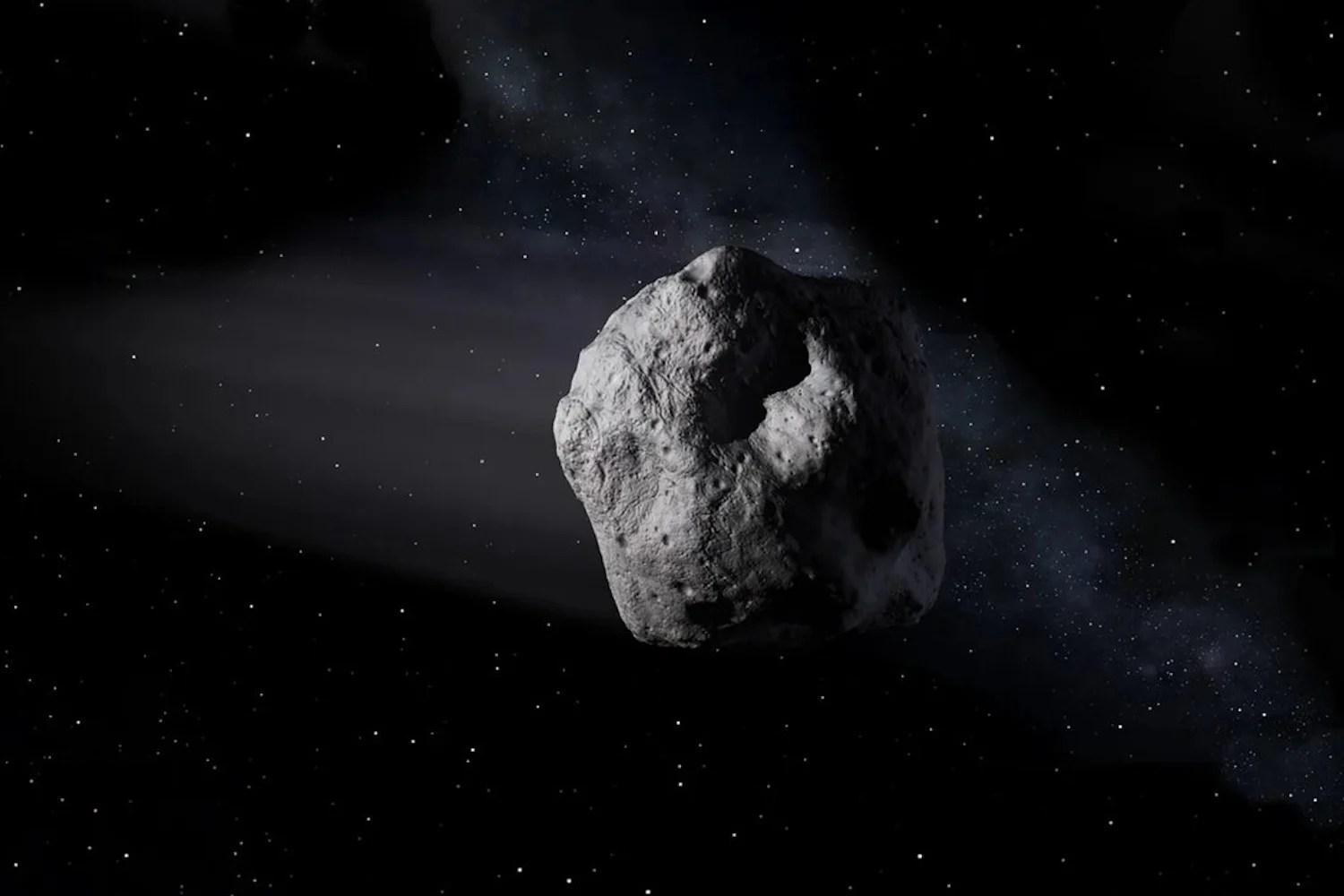 An illustration of an asteroid drifting through space.