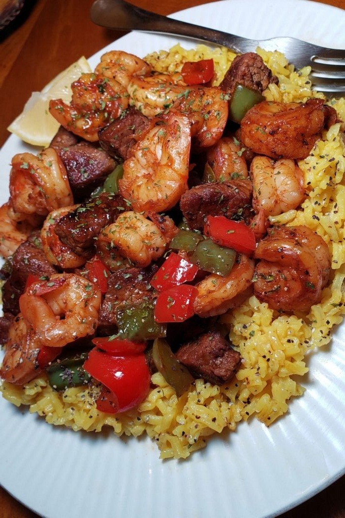 Jerk Steak & Shrimp over Yellow Rice Dekomfort