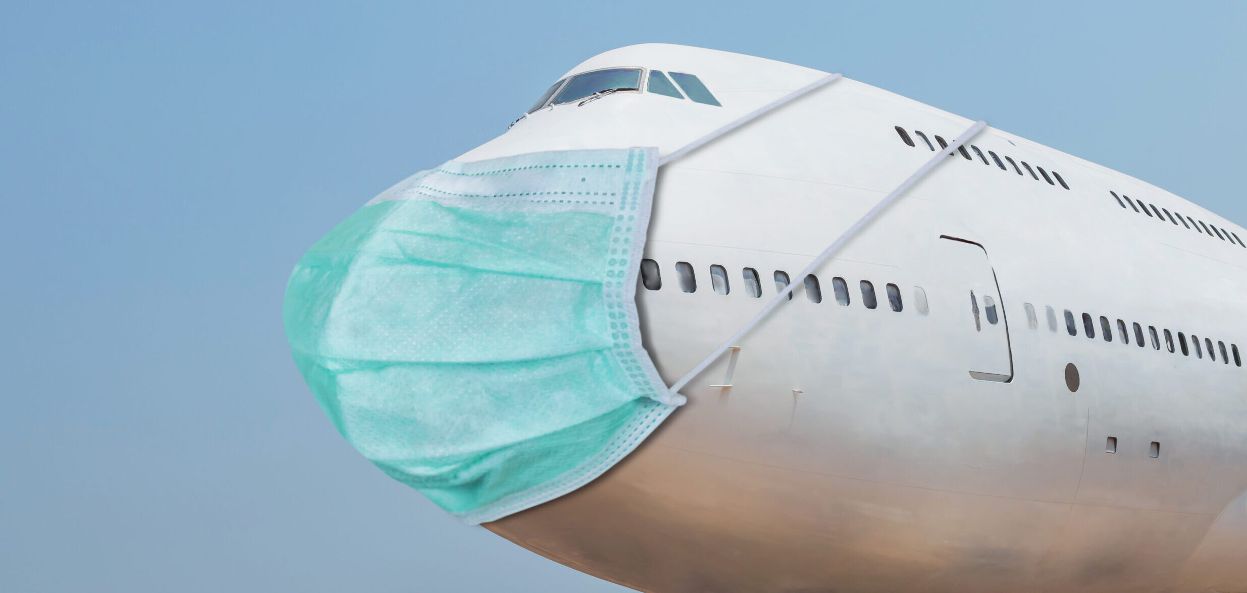 plane with a face mask Globetrender