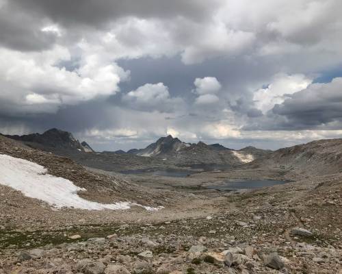 A storm approaches as we rest at the summit of Muir Pass