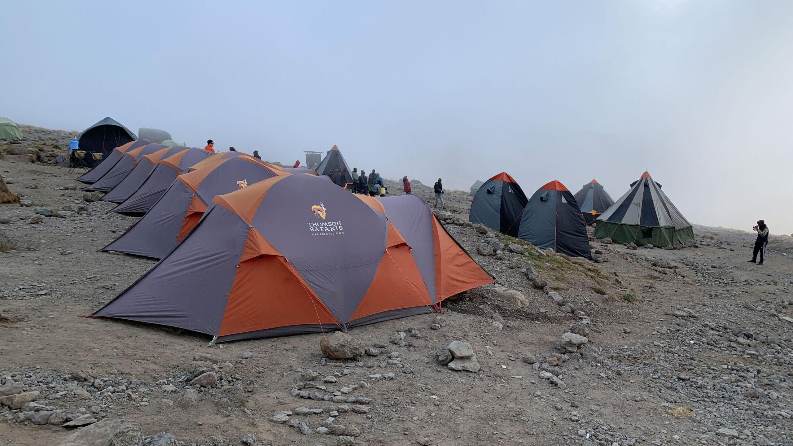 Neatly lined-up tents stand at attention as the clouds settle in over Karanga Camp on Mount Kilimanjaro.