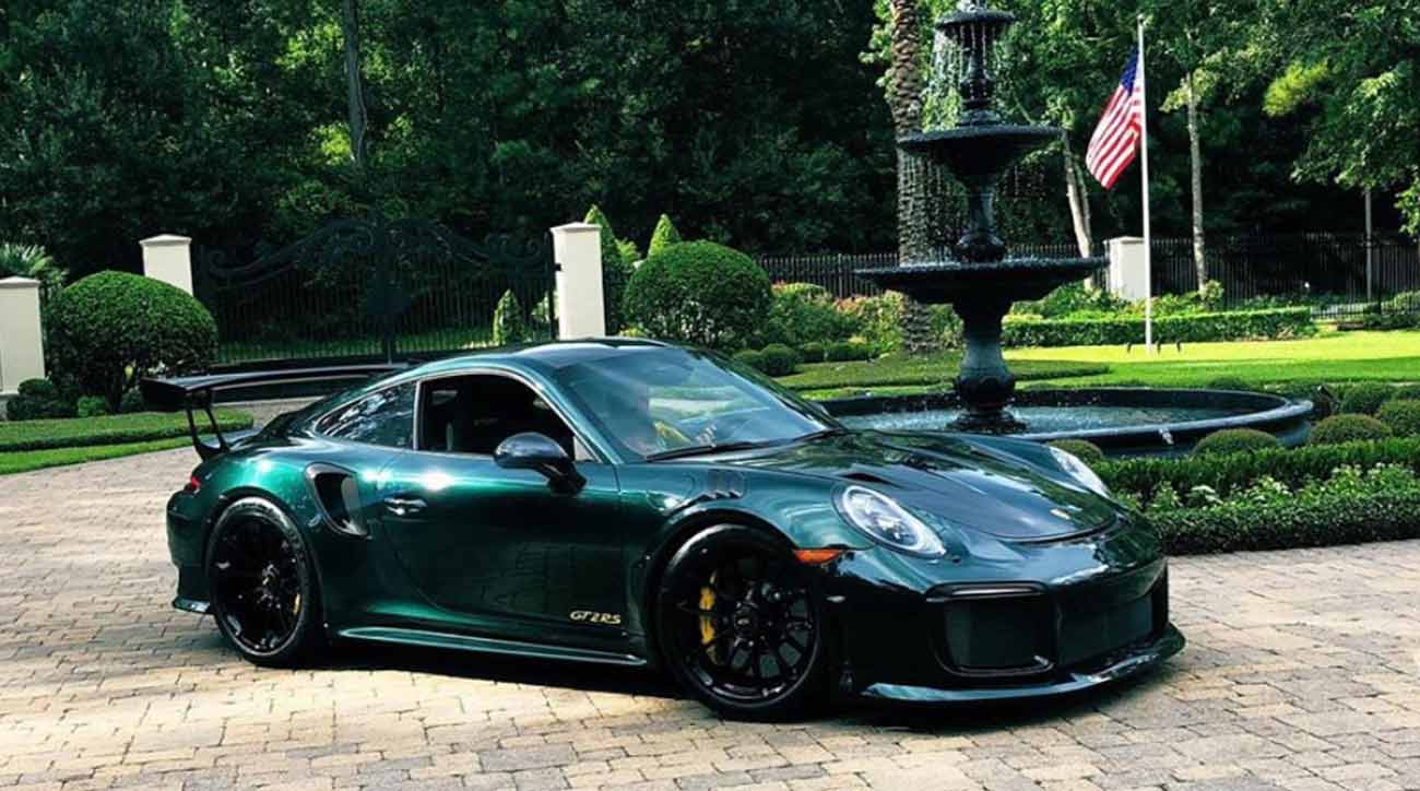 Here's Patrick Reed at the wheel of a stunning Mastersthemed Porsche 911