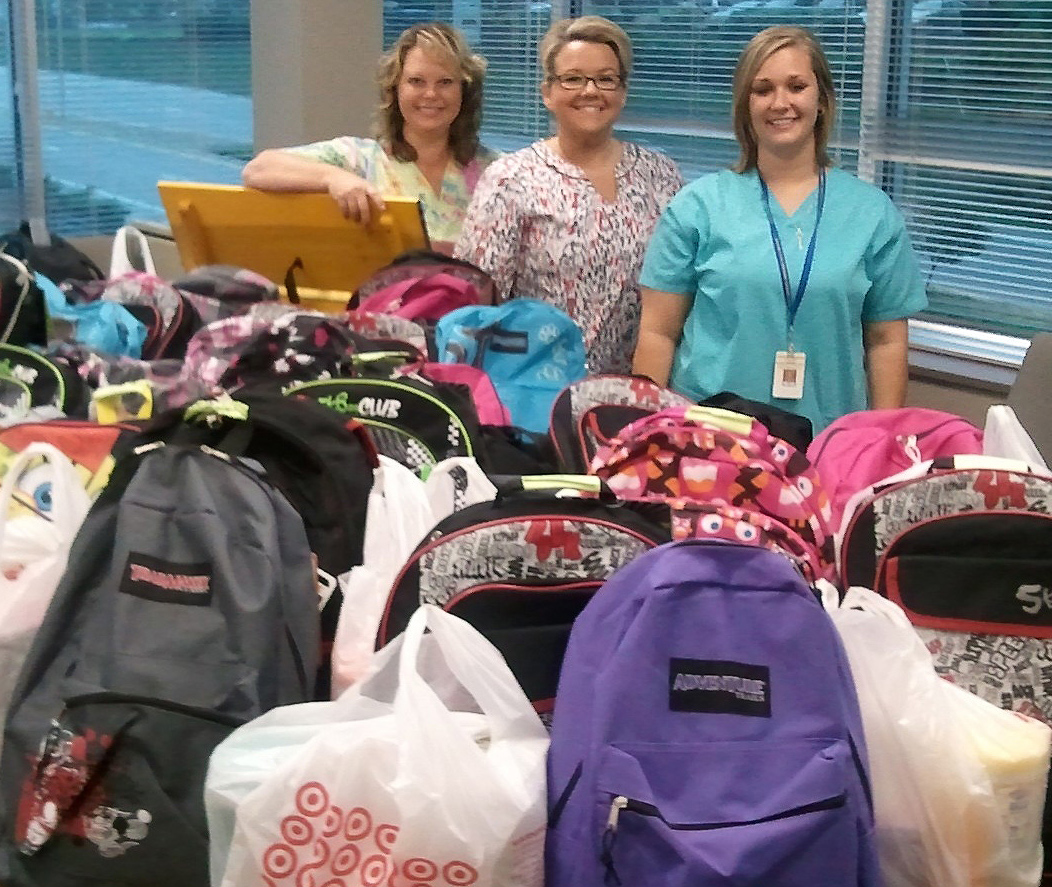 Group Health Associates backpack donations Good Things Going Around