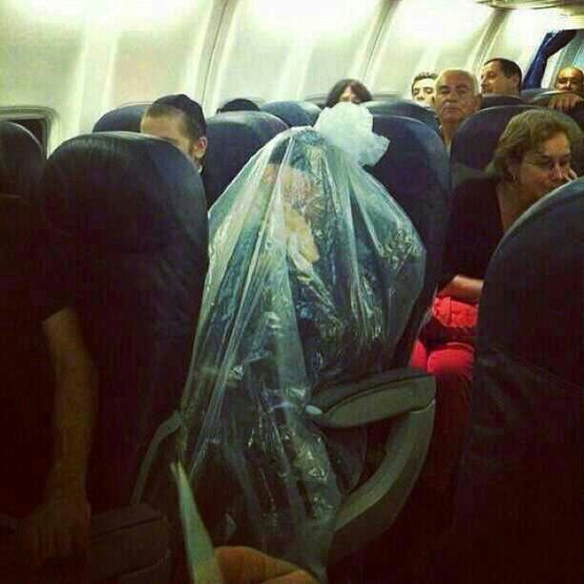 Photo Orthodox Jewish Man Covers Himself In Plastic Bag On Plane(015)