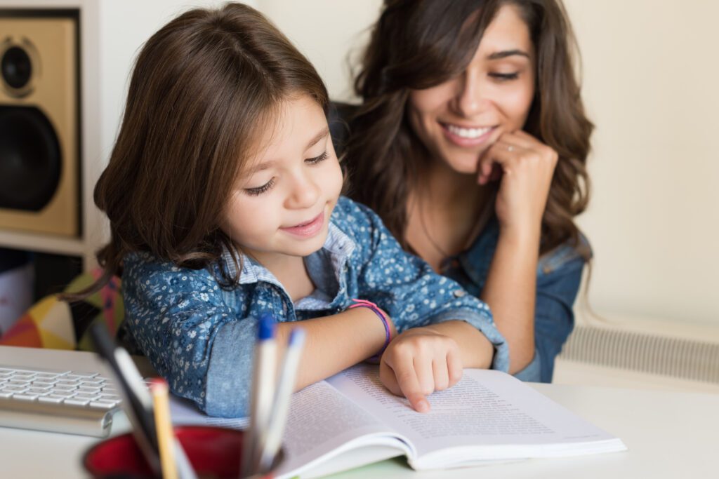 Mother helping child with homework GradePower Learning