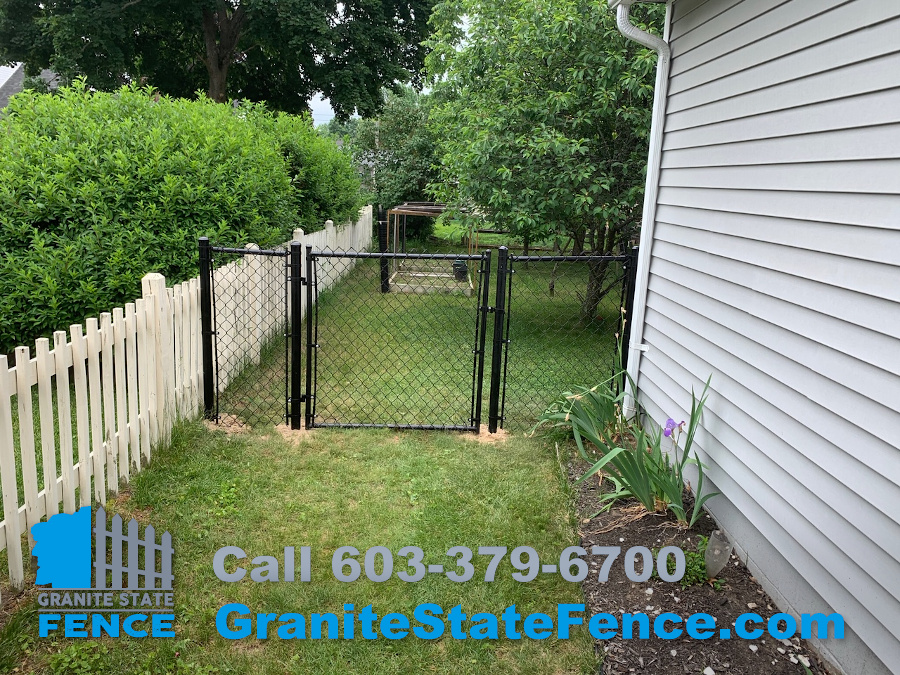 Black Chain Link fence installed in Nashua, NH. Granite State Fence