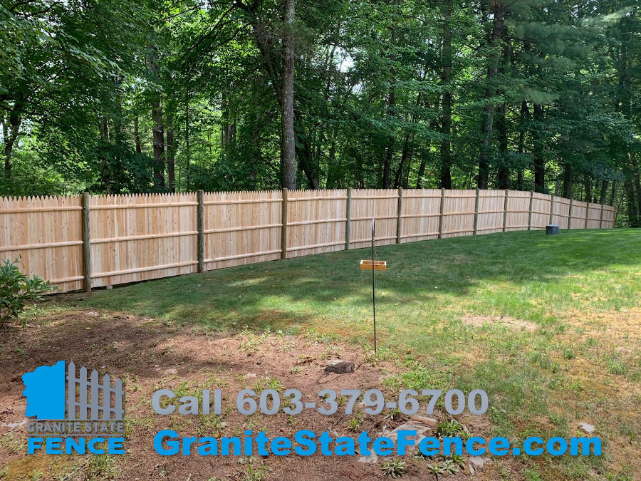 Cedar Stockade Fence installation in Londonderry, NH. Granite State Fence