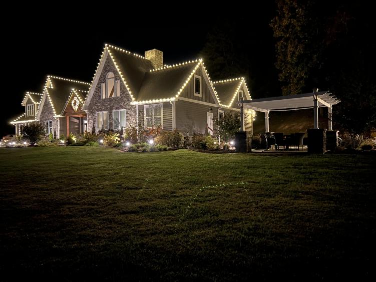 Hanging Christmas lights Grass Property Maintenance LLC