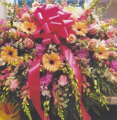 Light Yellow & Purple Flowers & Dark Pink Ribbon Bow Wreath Grave