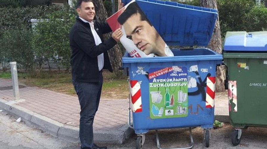 Attica Deputy Governor Throws Tsipras Poster in Recycle Bin