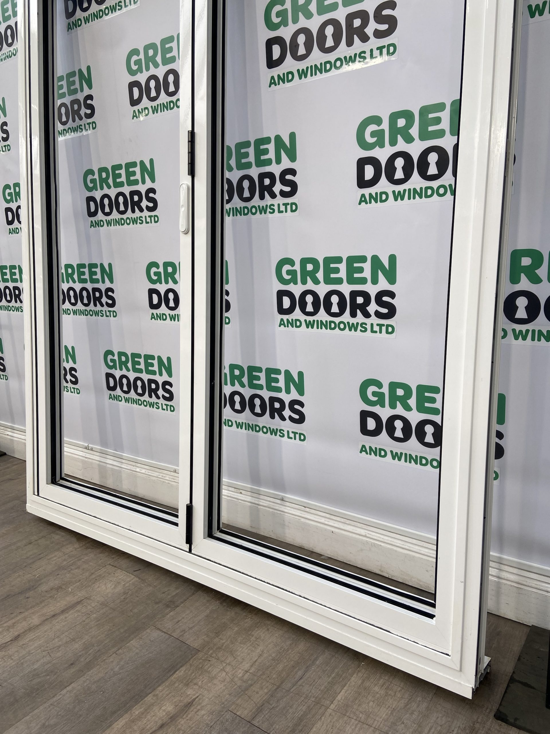 ALUK Aluminium White Bifolding Doors Green doors