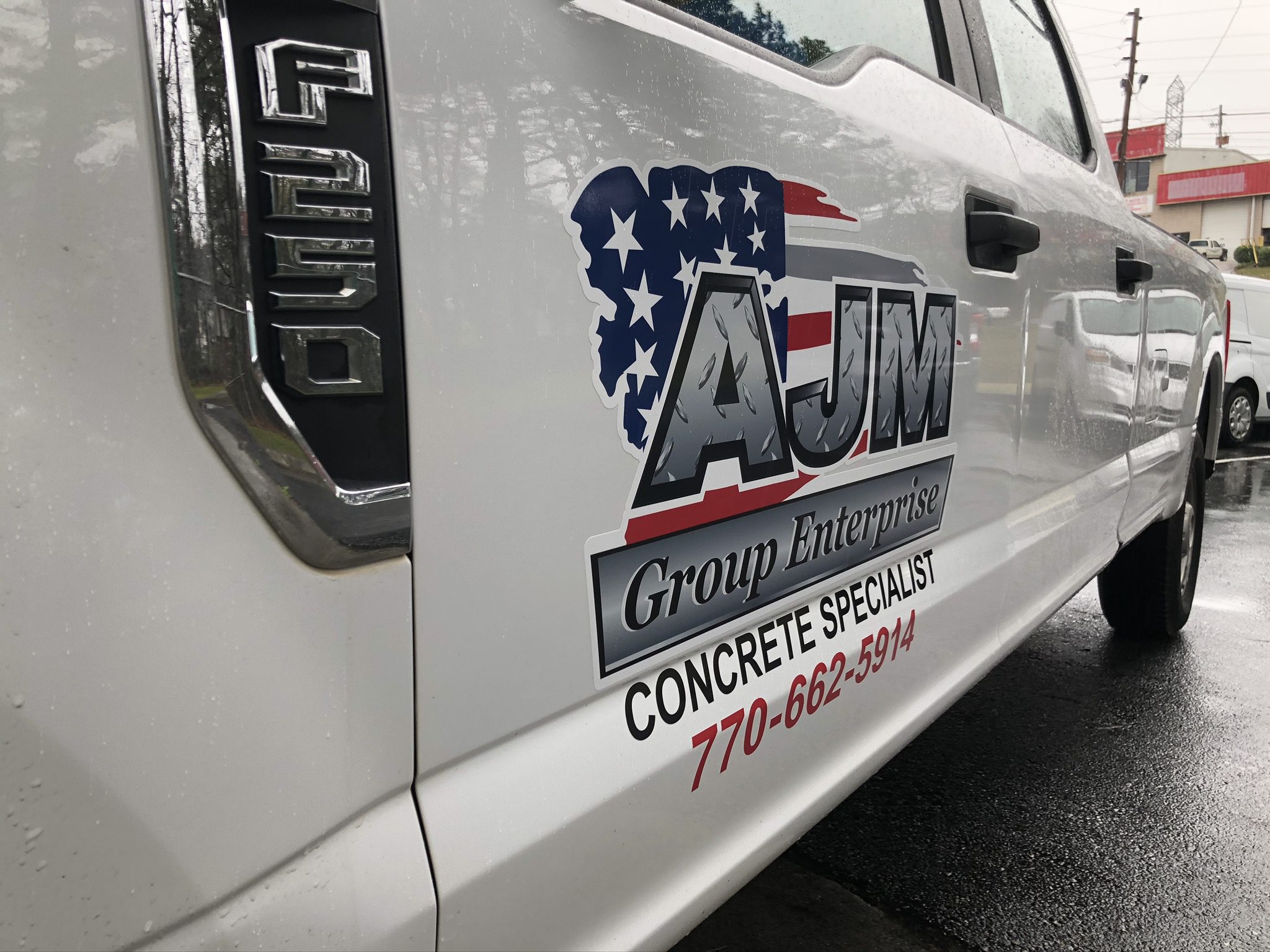 AJM Group Enterprise Vinyl Wrap on Truck Green Light Graphics