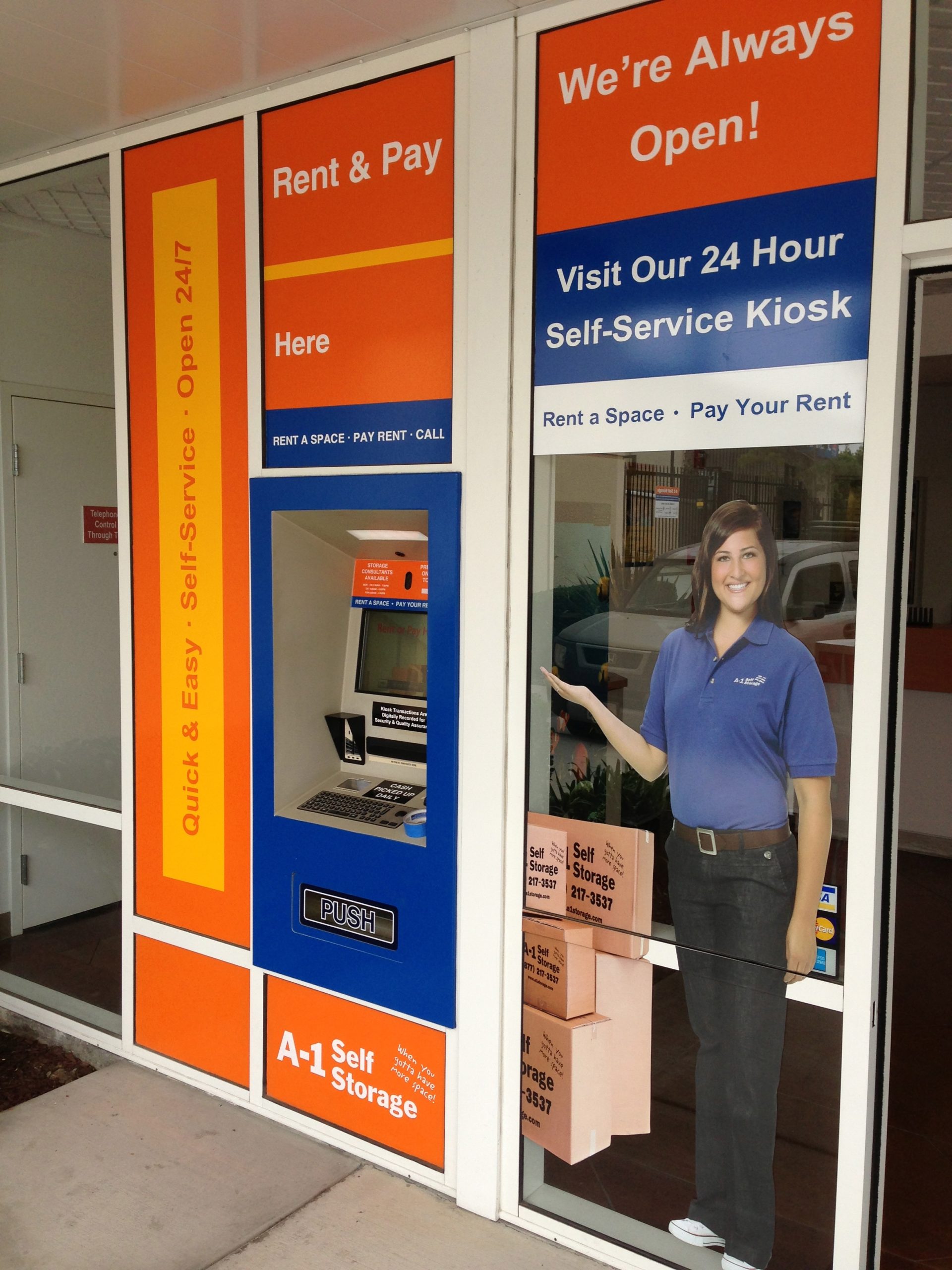 A1 Self Storage Vinyl Wrap on Business Front Windows Green Light Graphics