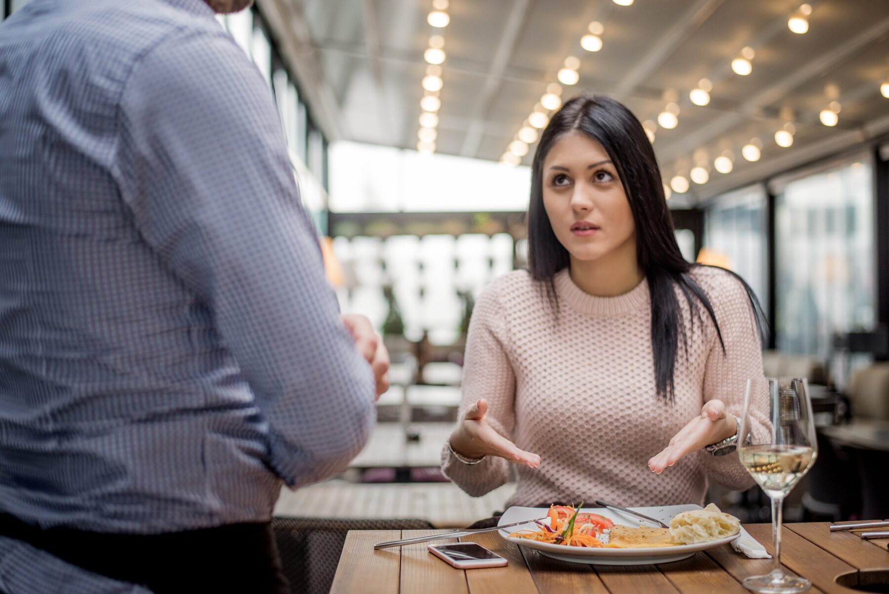 Portrait of woman complaining about food quality and taste in