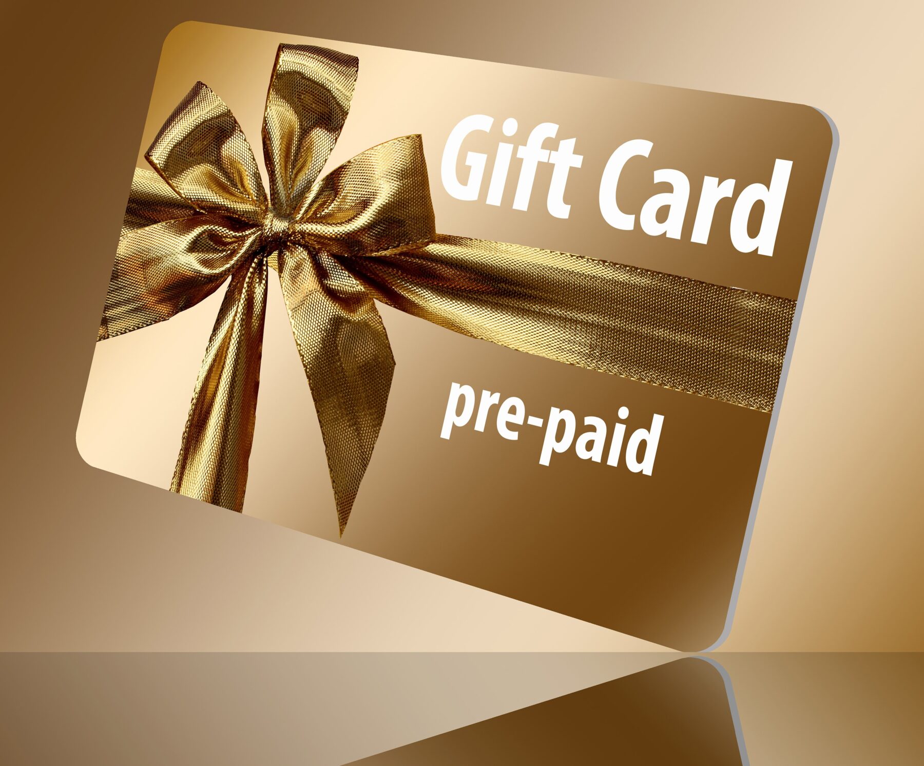 Gold bow on a gold prepaid gift card. GS Systems