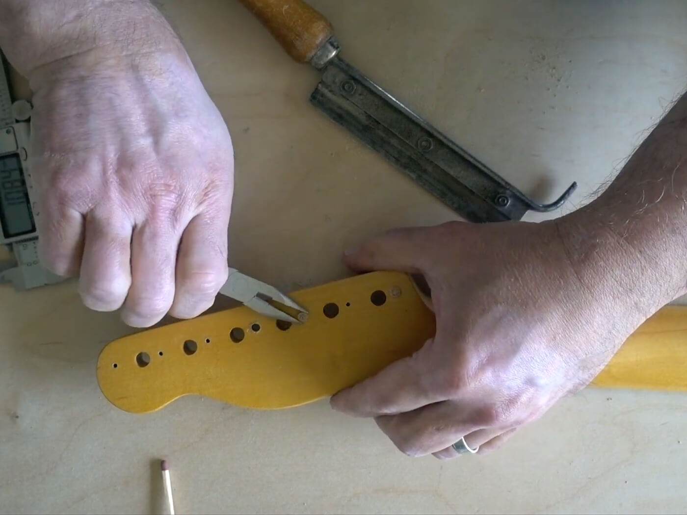 Watch How to extract a snapped screw from your guitar using a simple