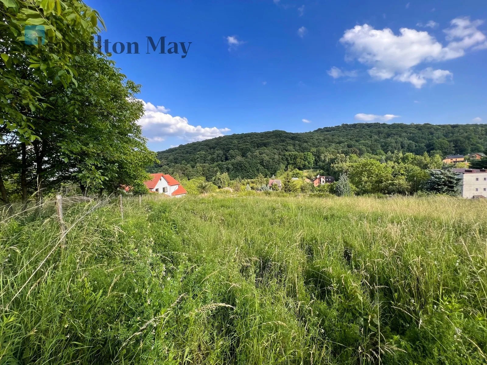 For sale, a zoned building plot with elevated position and views over