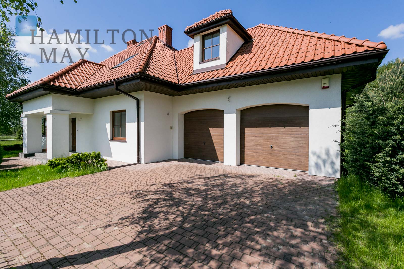 A polishstyle house in a discreet settlement by Magdalenka Rudzika