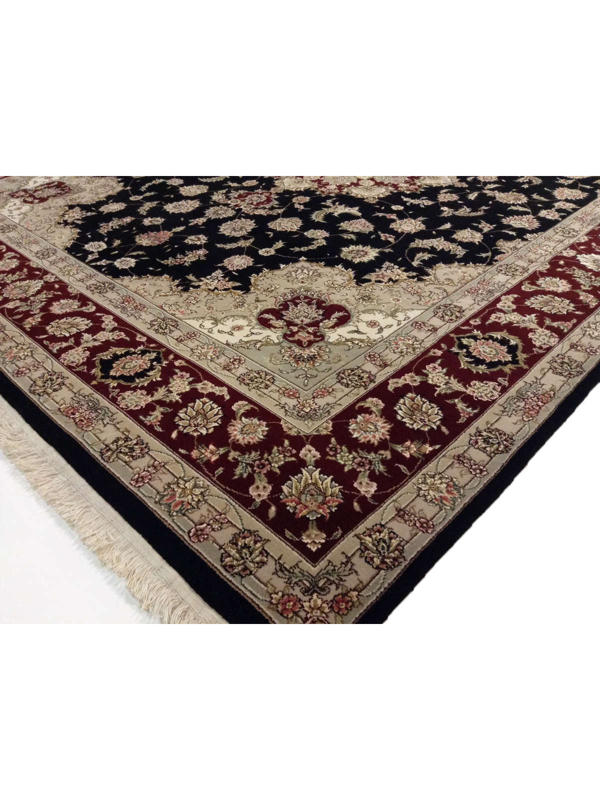 The Handloom Emporium Inc Importers of Handknotted Oriental Rugs.