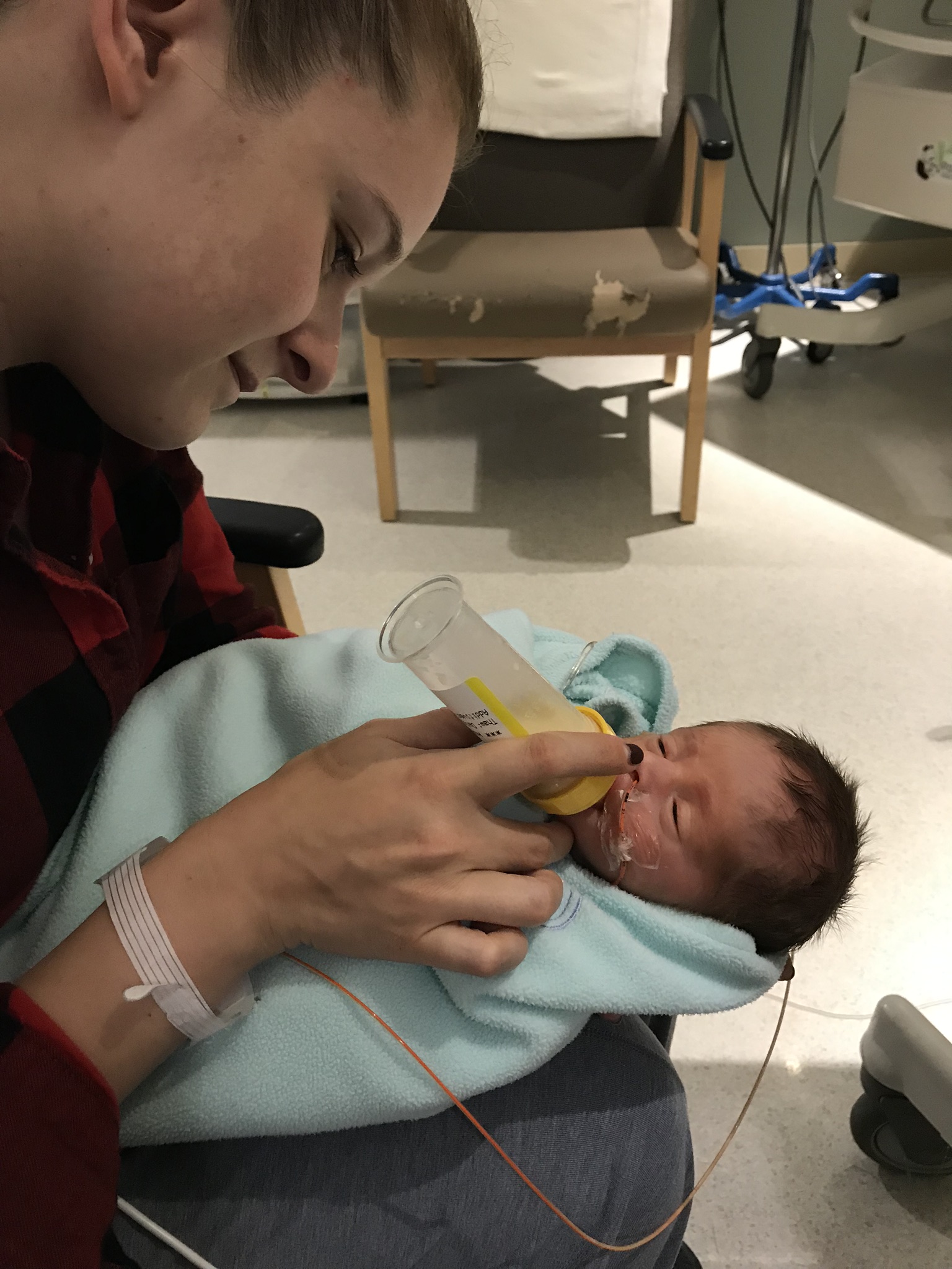 NICU Milestones The First Bottle in the NICU Hand to Hold