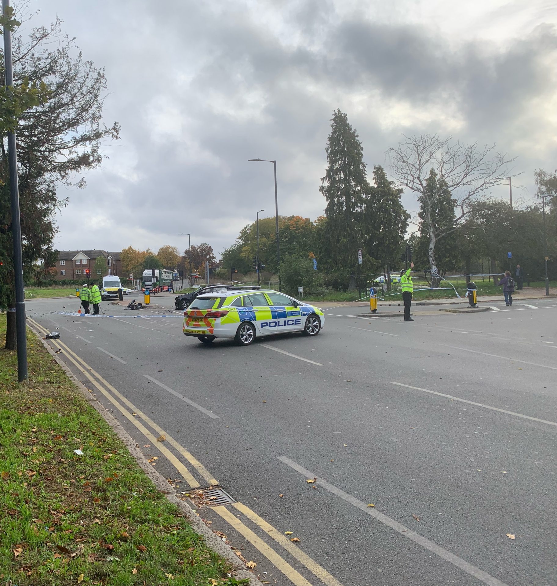 First photos show Honeypot Lane closed off and debris in the road