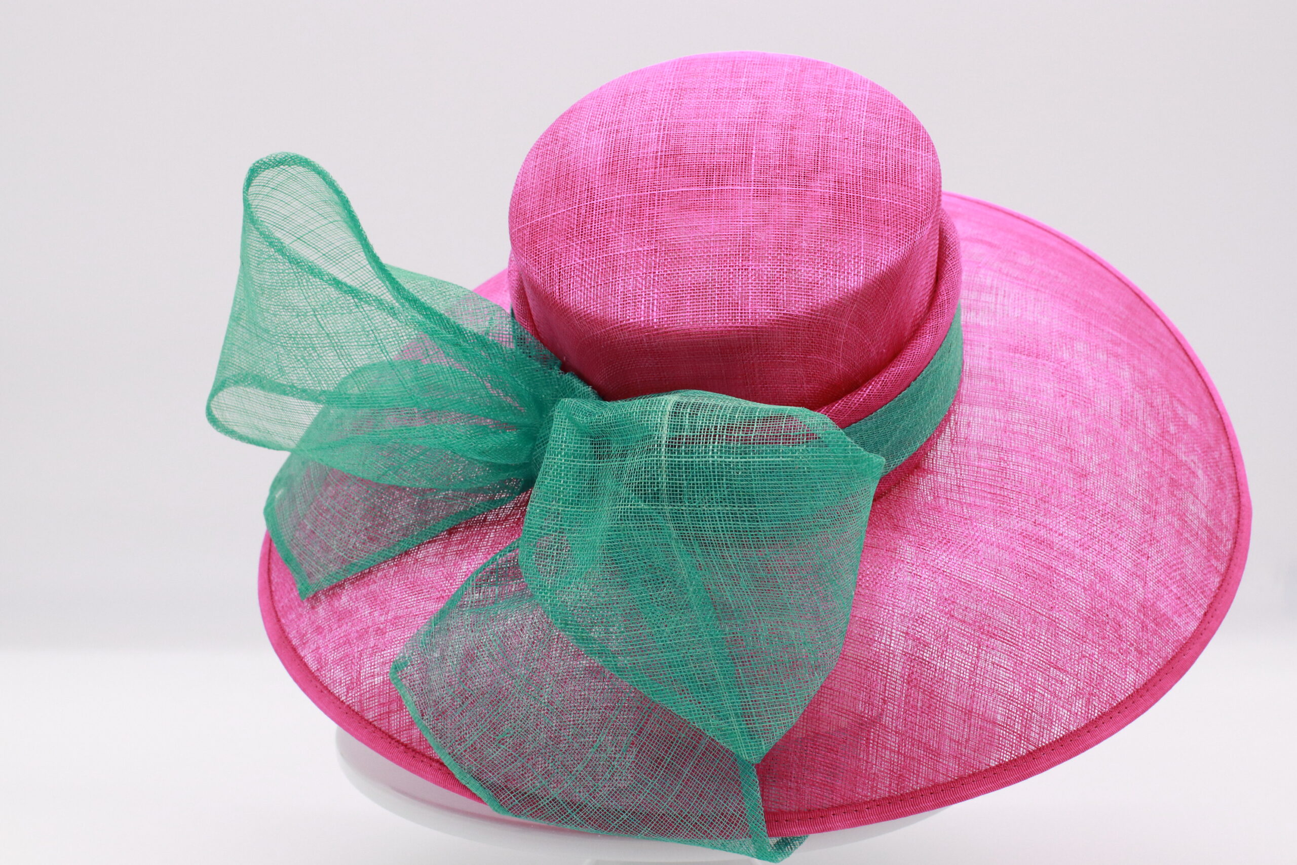 Hot Pink Sinamay Hat with Oversized Turquoise Bow Hat Rack