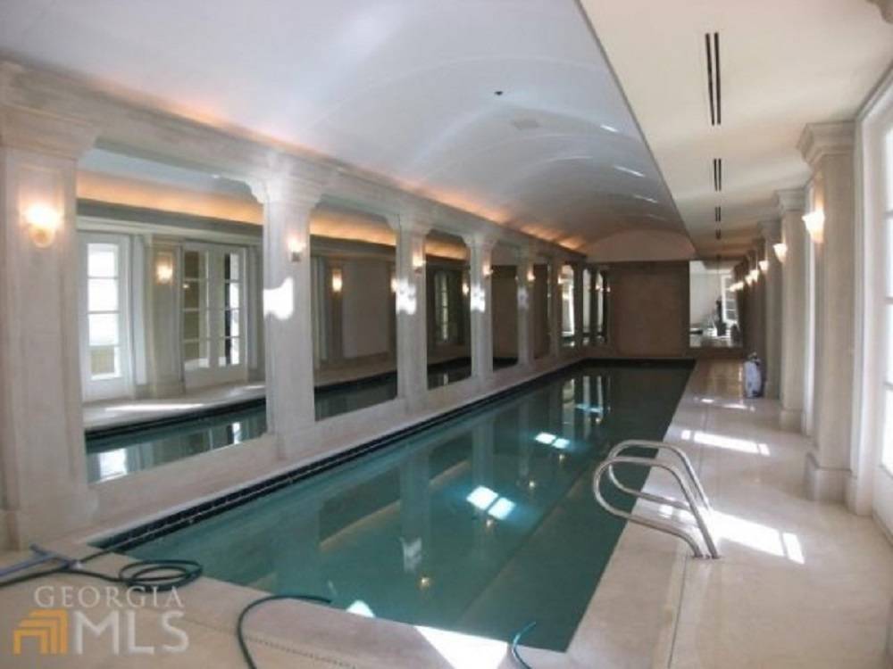 Rick Ross Buys Evander Holyfield Estate With Charitable Intentions